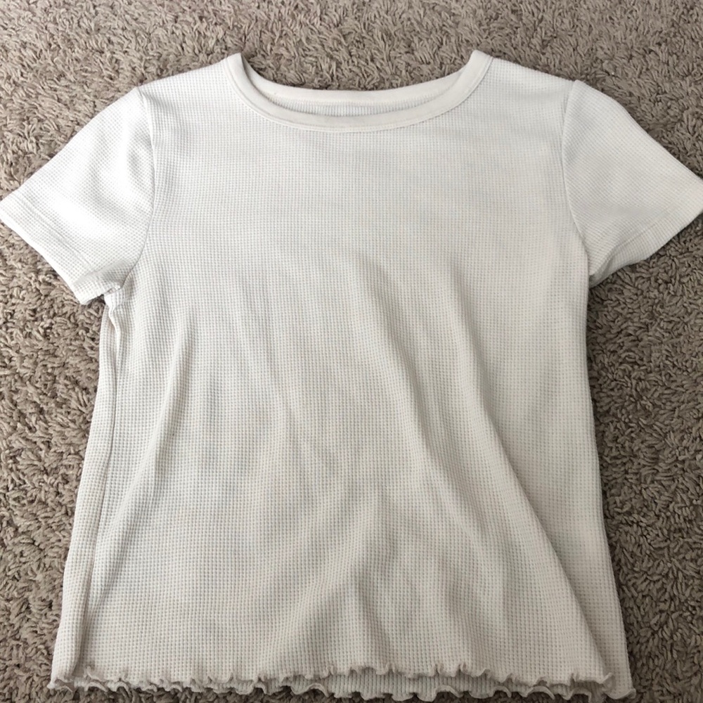Cute waffle style shirt with ruffles on bottom